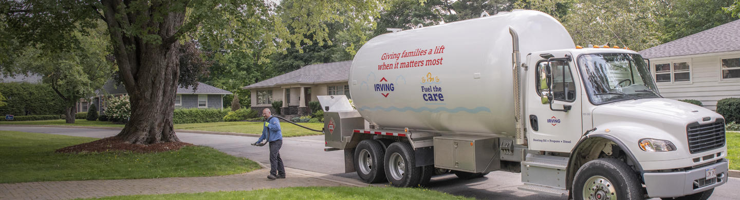 Irving Energy Technician fueling propane in residential area 