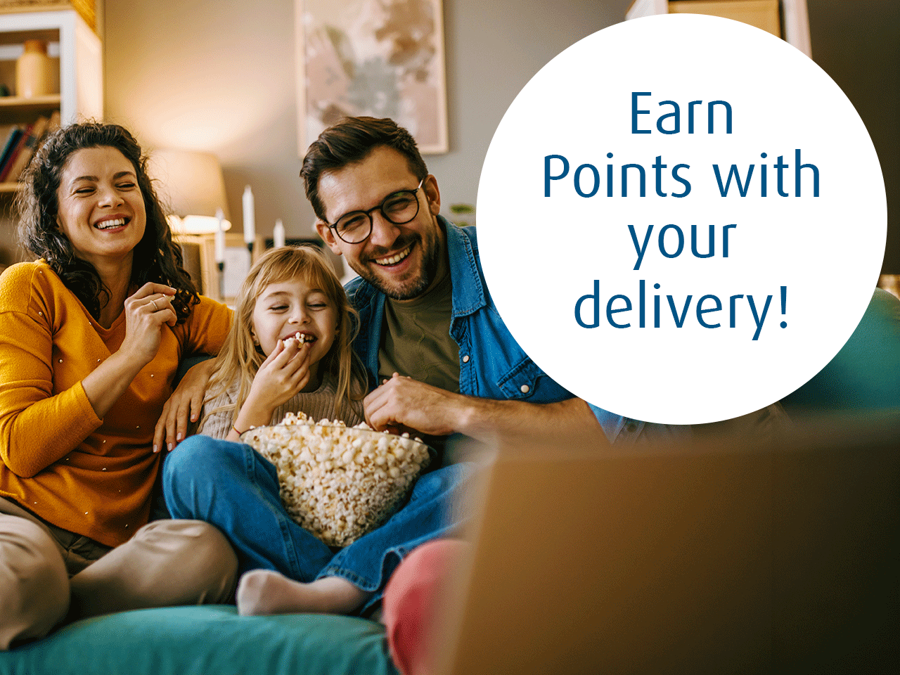Three people sit on a couch eating popcorn in a living room while looking toward a laptop in the foreground; overlaid text reads “Earn Points with your delivery!”
