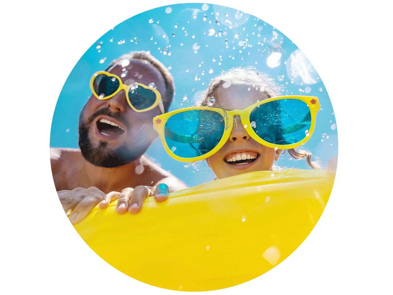 Two people wearing oversized colorful sunglasses hold a yellow float in blue water as droplets splash toward the camera.