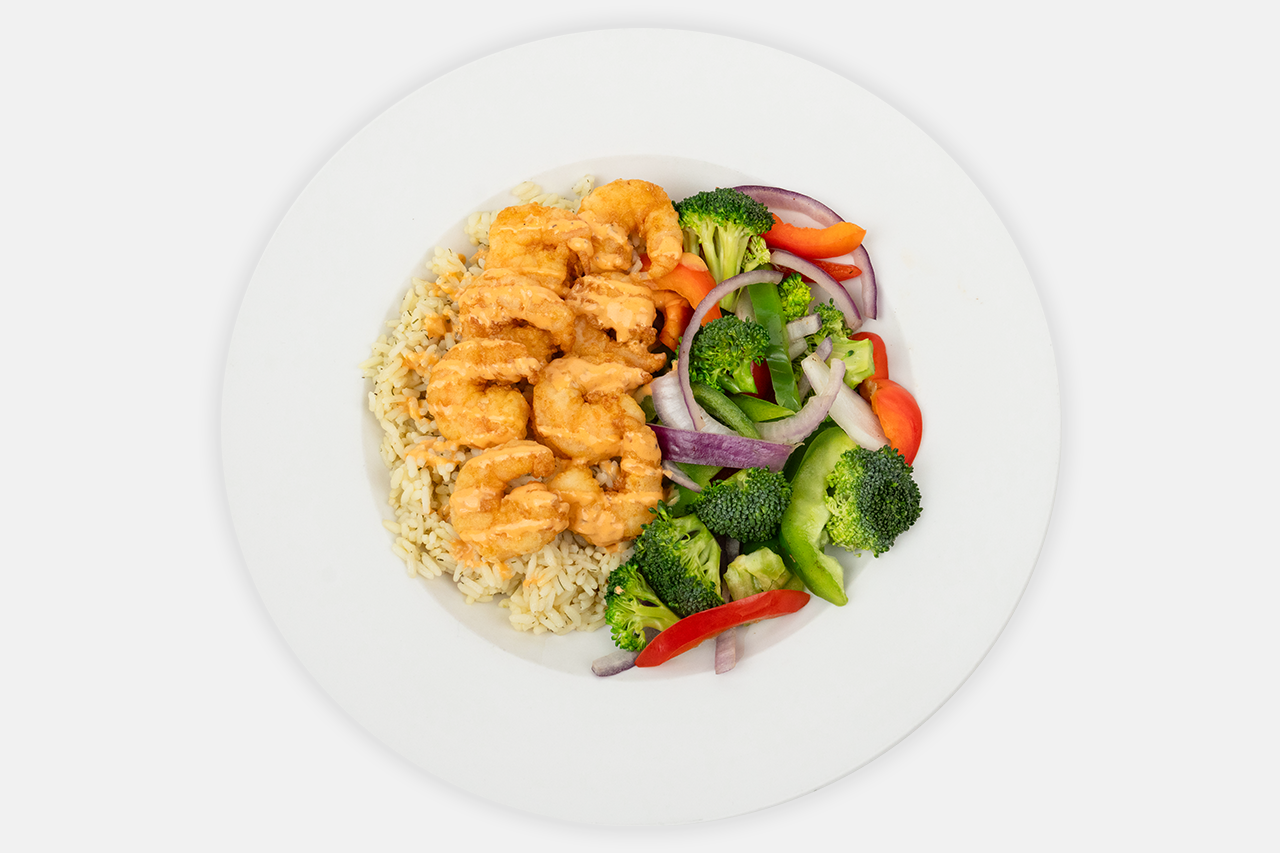A plate of crispy shrimp bowl served with vegetable and rice