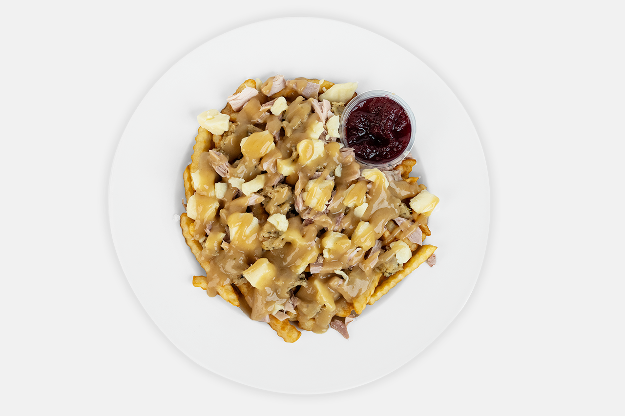 A plate of Turkey poutine dinner