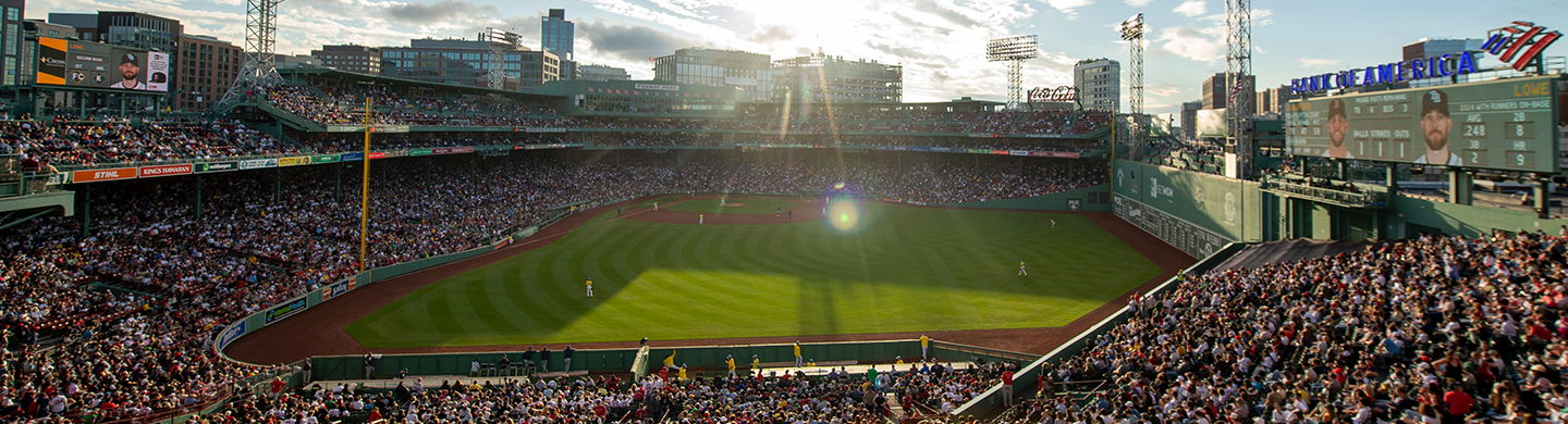 A stadium filled with people on a bright sunny day