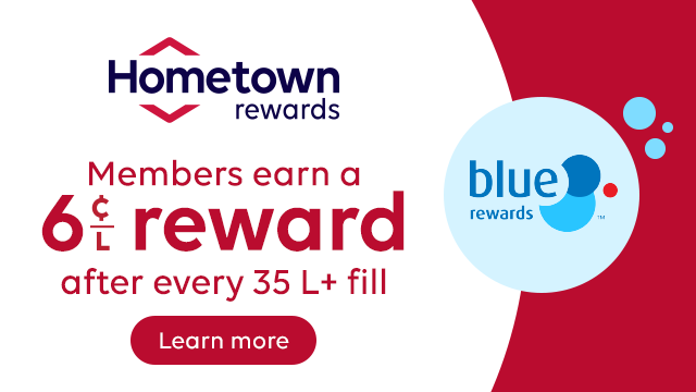 Hometown Rewards promotional banner. Text: “Members earn a 6¢/L reward after every 35 L+ fill.” Hometown Rewards logo on the left, Blue Rewards logo on the right, and a “Learn more” button below the offer.