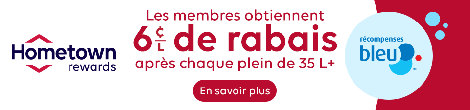 Hometown Rewards promotional banner. Text: “Members earn a 6¢/L reward after every 35 L+ fill.” Hometown Rewards logo on the left, Blue Rewards logo on the right, and a “Learn more” button below the offer.