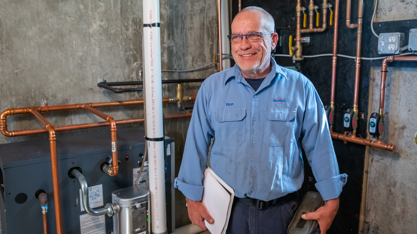 Irving Energy employee providing information on heating oil equipment upgrade