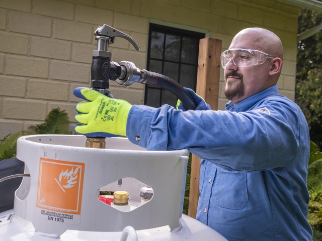 Irving Energy Technician refilling the propane tank 