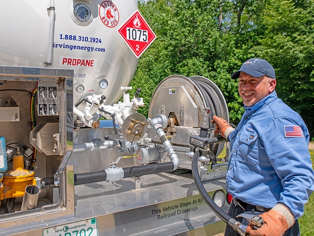 Irving Energy Technician preparing to install propane in residential area 